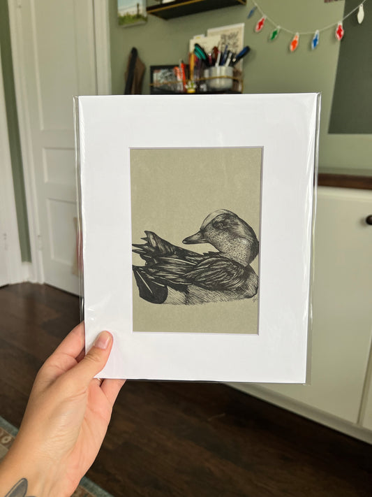 Hand holding an drawing of a duck