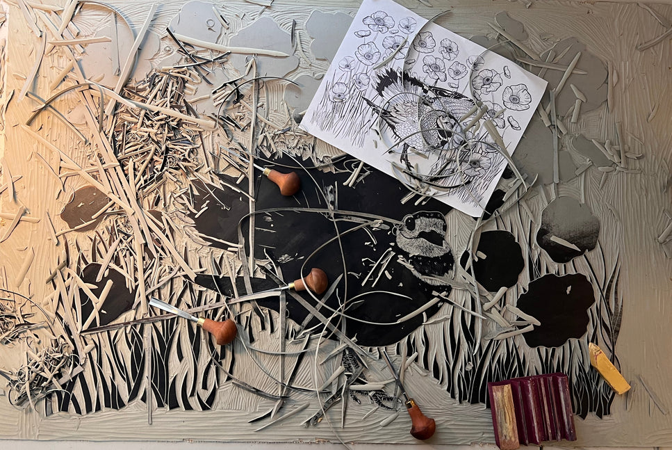 Artistic arrangement of linoblock carving with carving tools.