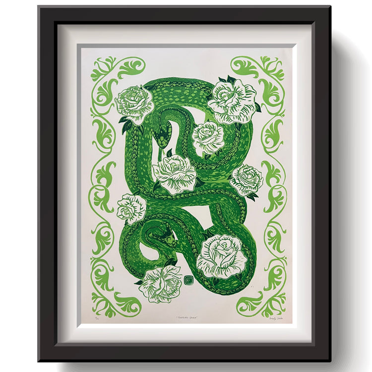 Famed art print of two snakes intertwined with white roses and a boarder.