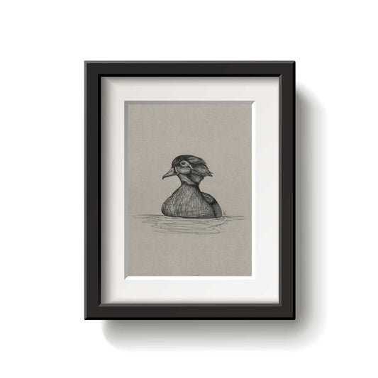 Framed artwork of a duck on a beige background