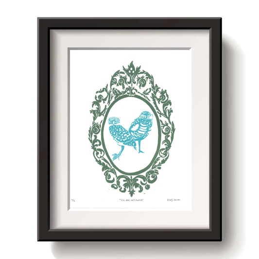 Framed artwork with a decorative burrowing owl design blue ink on a white background