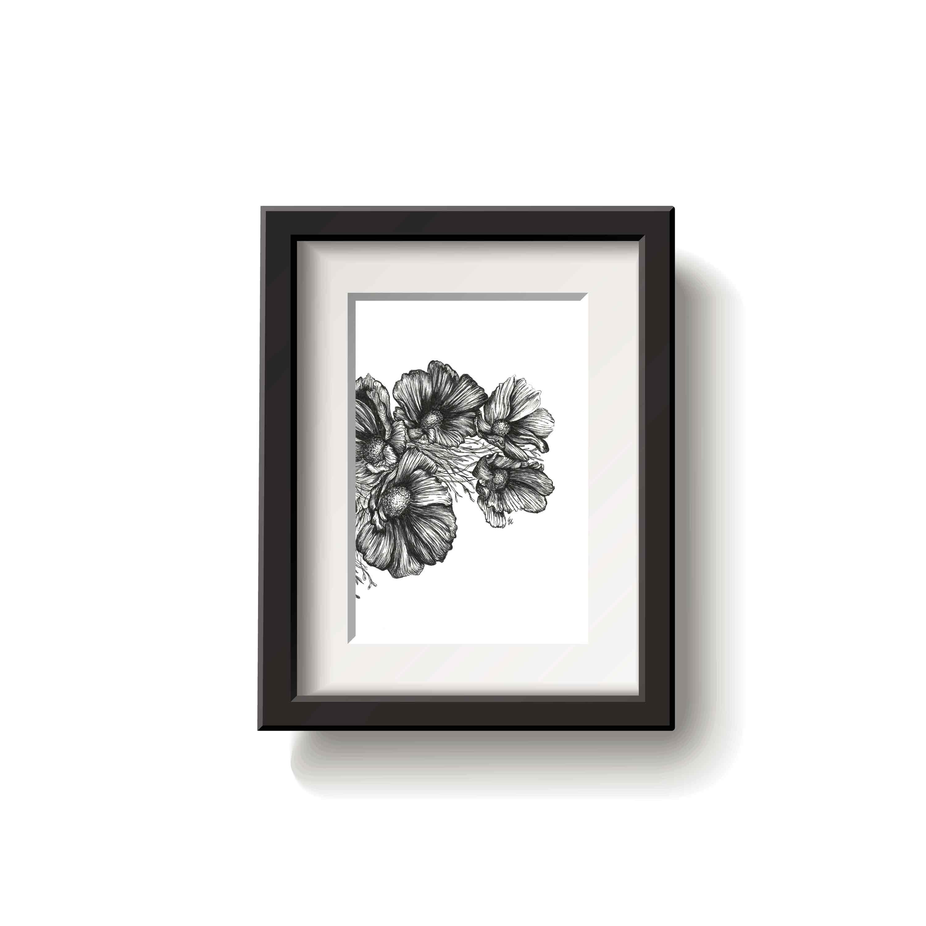 Framed black and white floral drawing on a white wall