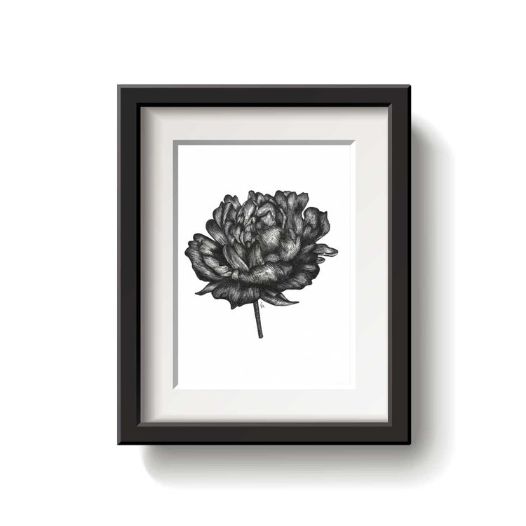 Framed black and white floral artwork on a white background