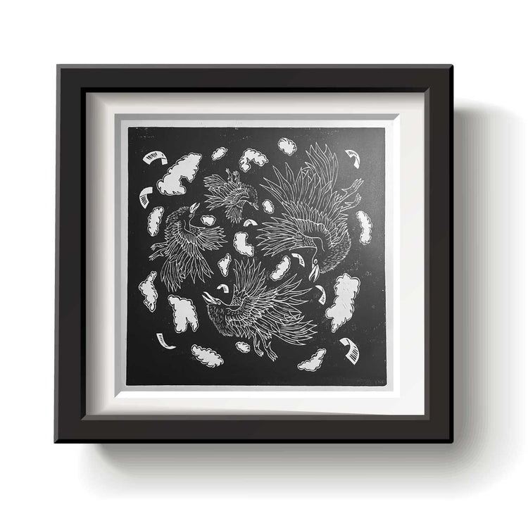 Framed artwork with black and white crow design on a white background