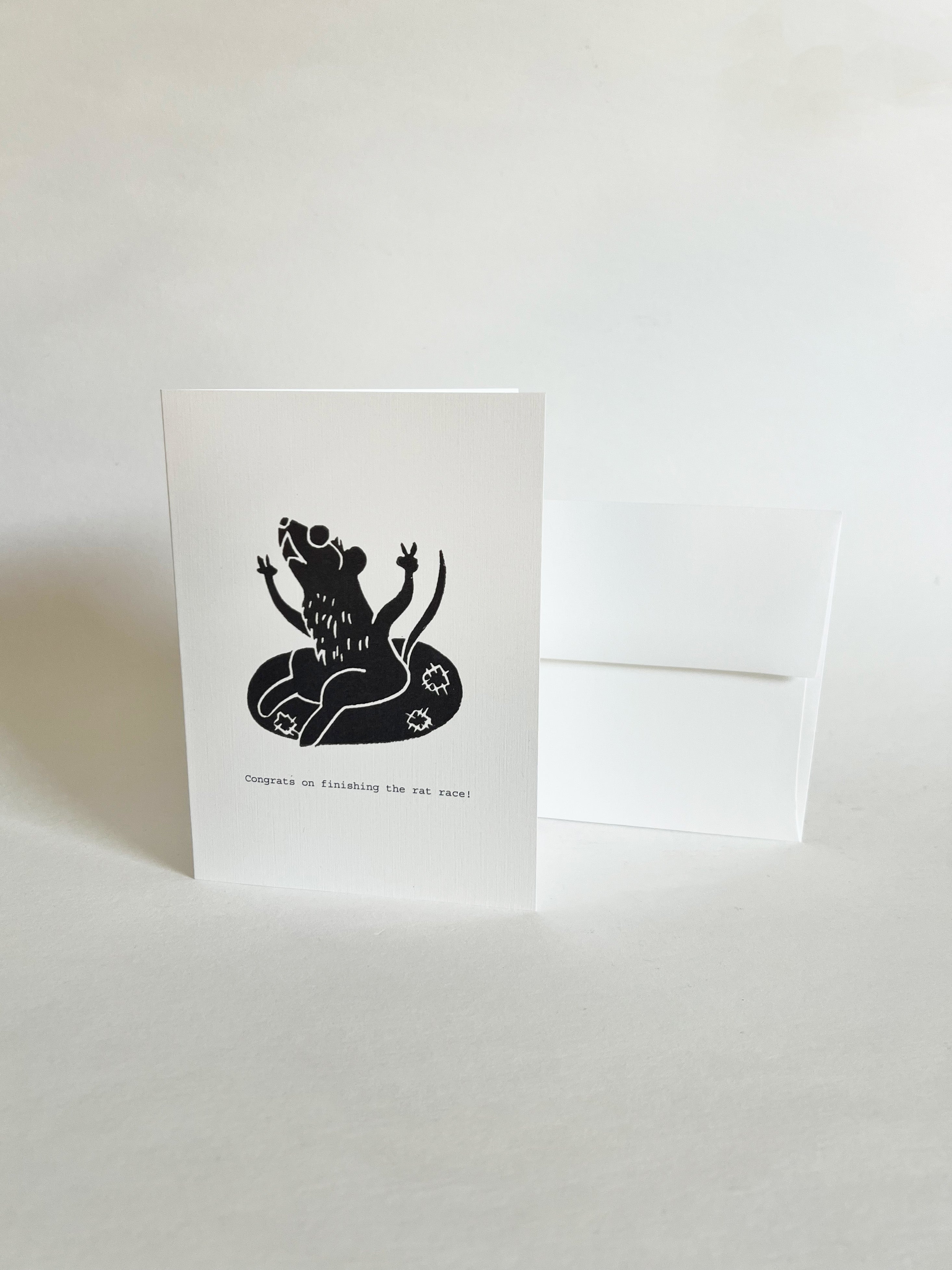Greeting card with a black rat in an inter tube illustration on a white background