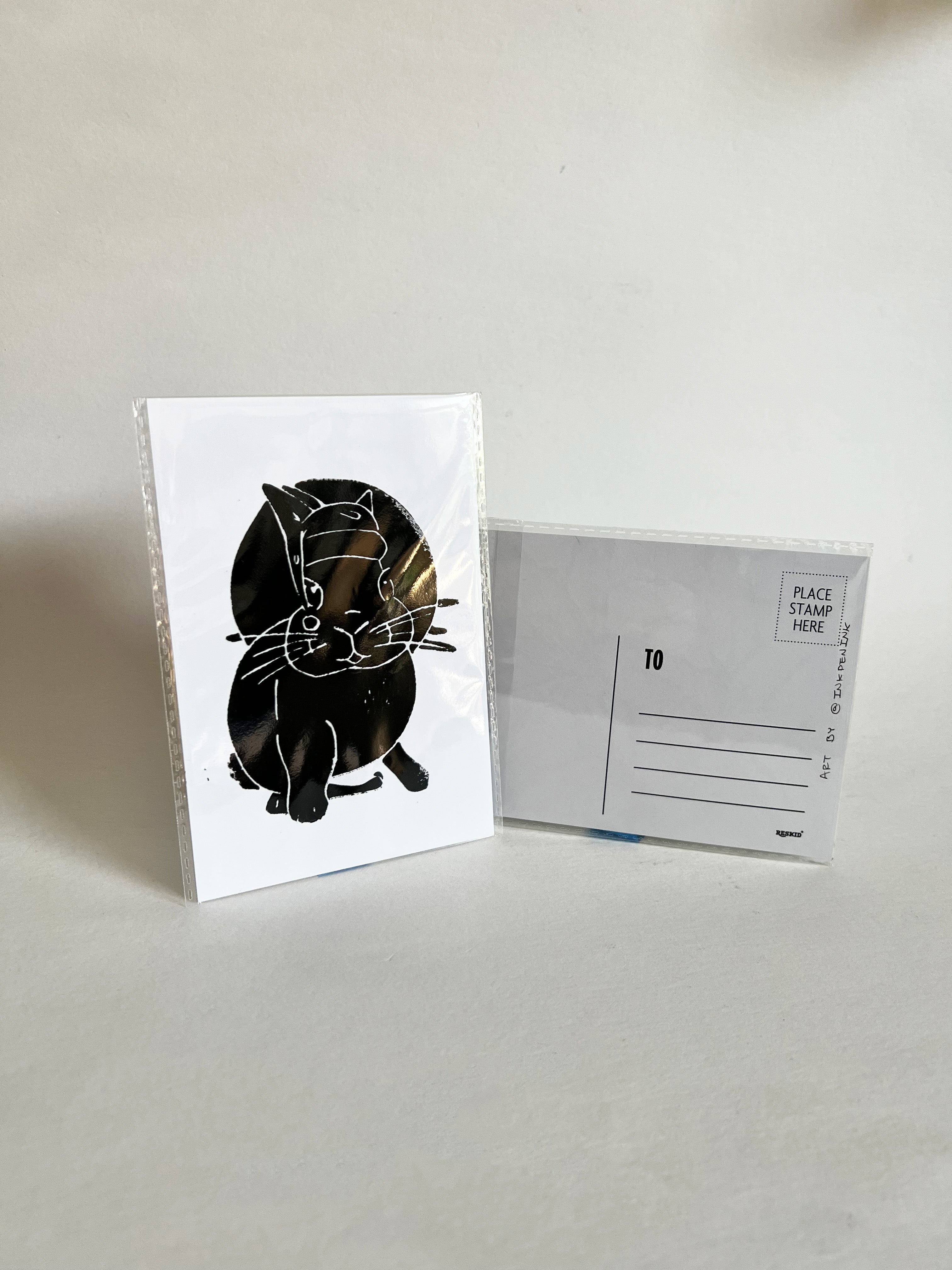 Greeting card with black bunny with a hat illustration on white background