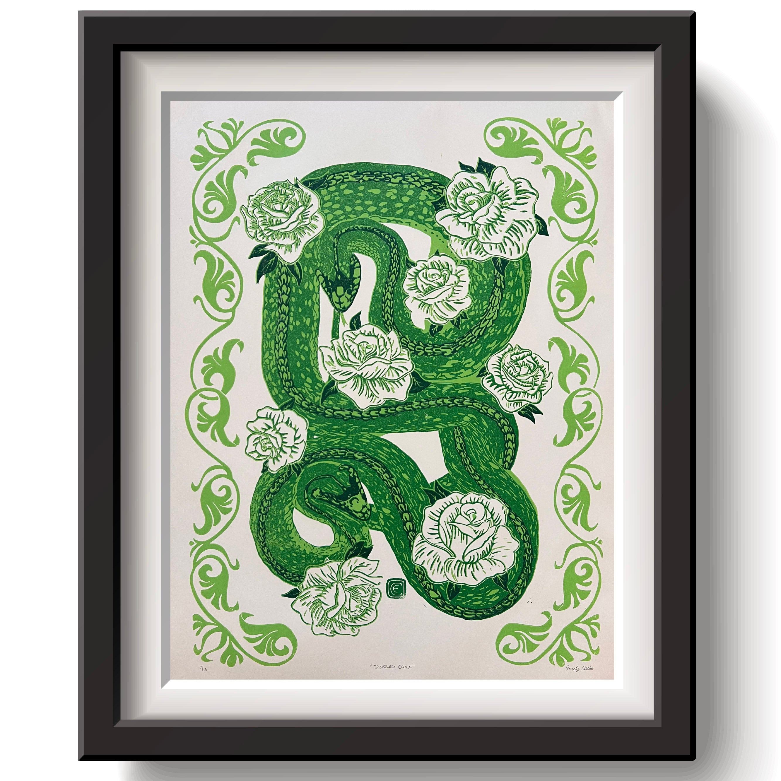 Famed art print of two snakes intertwined with white roses and a boarder. 