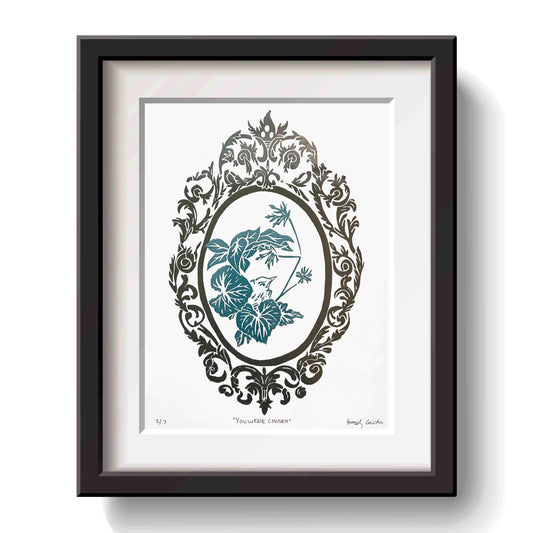 Framed artwork with a decorative baby Robbin design blue ink on a white background